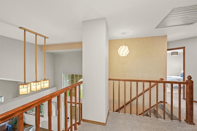 1190 W 11th Ct, Broomfield, CO 80020 - hall with an upstairs landing, carpet floors, and baseboards