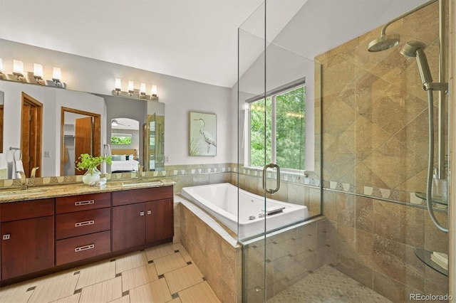 1190 W 11th Ct, Broomfield, CO 80020 - full bathroom with a shower stall, double vanity, a garden tub, and vaulted ceiling