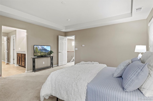 carpeted bedroom featuring ensuite bathroom