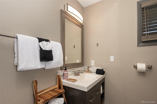 bathroom with backsplash and vanity