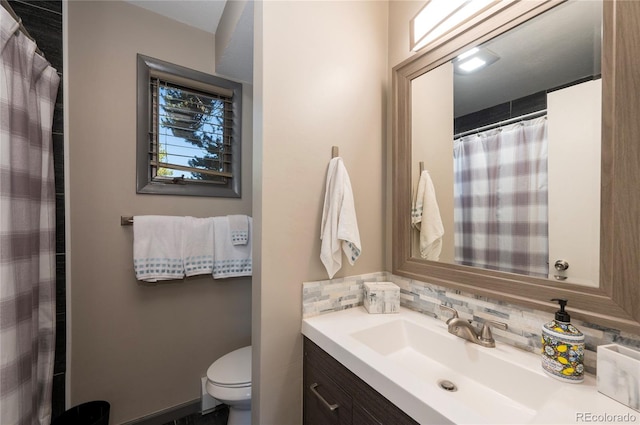 bathroom featuring vanity, toilet, a shower with curtain, and backsplash