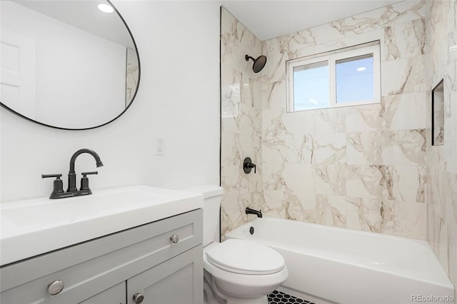 full bathroom with tiled shower / bath combo, toilet, and vanity