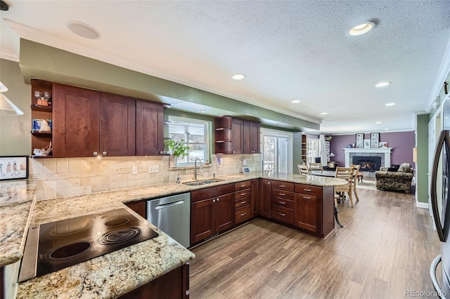 kitchen featuring open shelves, a sink, wood finished floors, dishwasher, and black electric cooktop