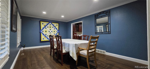 dining space featuring visible vents, baseboards, and wood finished floors