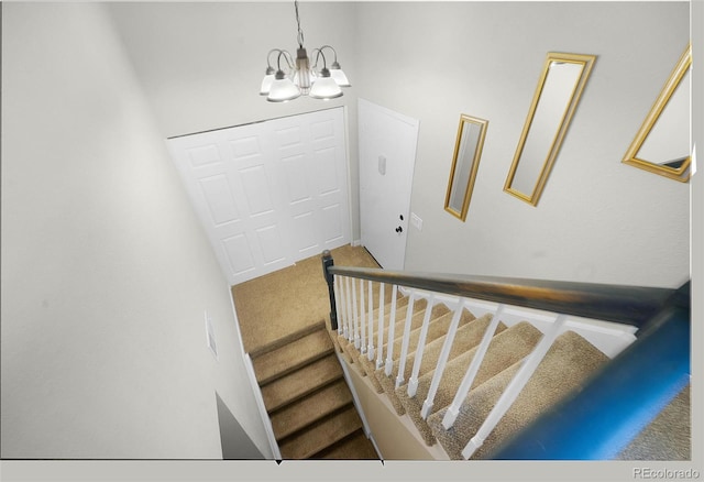 5771 W 92nd Ave Unit 328, Westminster, CO 80031 - stairs with a chandelier and carpet flooring