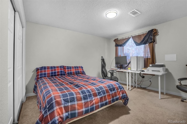 5771 W 92nd Ave Unit 328, Westminster, CO 80031 - carpeted bedroom featuring a textured ceiling and a closet