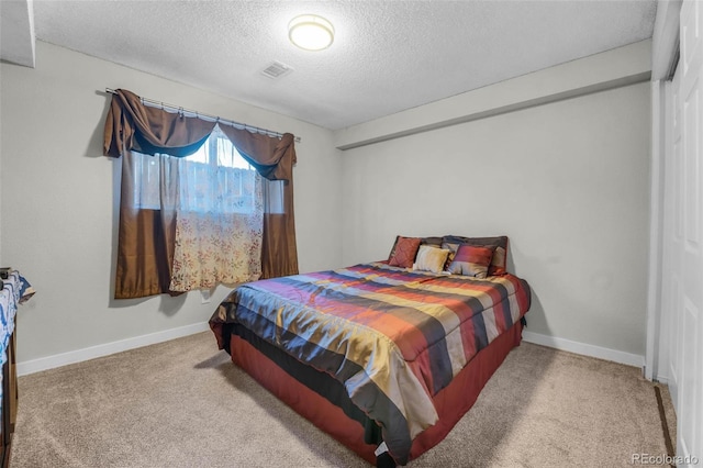 5771 W 92nd Ave Unit 328, Westminster, CO 80031 - bedroom featuring a textured ceiling and carpet flooring