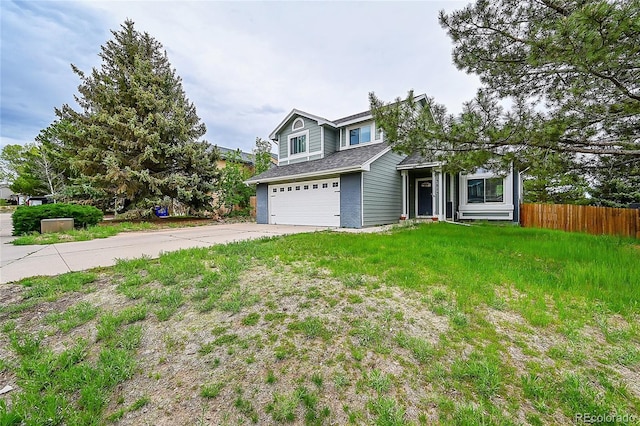 view of front of house featuring a garage and a front lawn