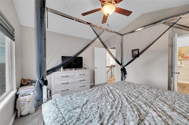 bedroom featuring ceiling fan and vaulted ceiling