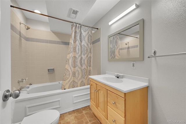 full bathroom with vanity, toilet, and shower / bath combo with shower curtain