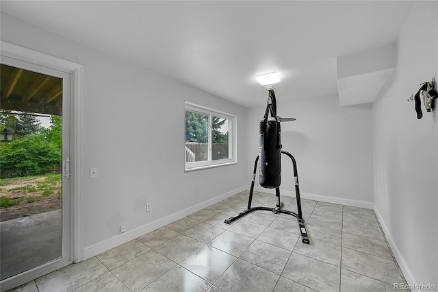 workout room with light tile patterned floors