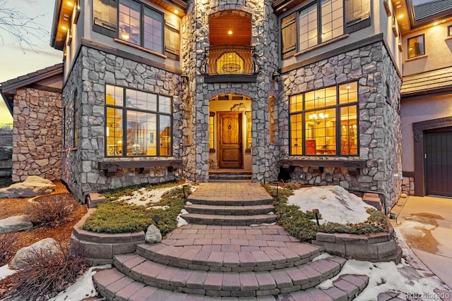 5810 Amber Ridge Dr, Castle Pines, CO 80108 - property entrance featuring stone siding and a balcony