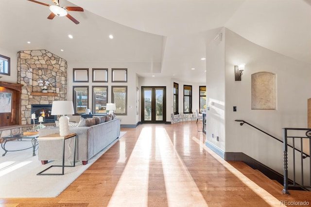 5810 Amber Ridge Dr, Castle Pines, CO 80108 - living room with plenty of natural light, a ceiling fan, recessed lighting, light wood-style flooring, and vaulted ceiling