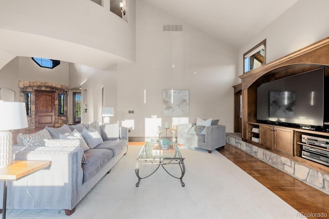 5810 Amber Ridge Dr, Castle Pines, CO 80108 - living area featuring high vaulted ceiling, wood finished floors, and healthy amount of natural light