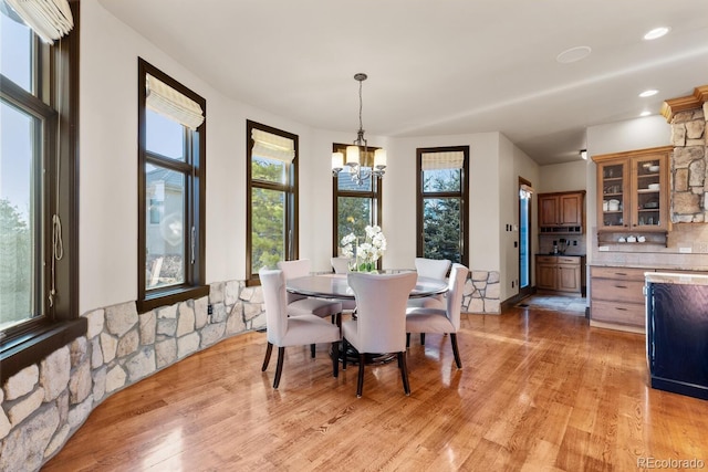 5810 Amber Ridge Dr, Castle Pines, CO 80108 - dining area featuring a chandelier, light wood-style floors, and recessed lighting