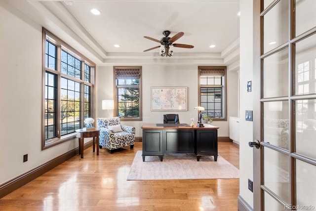 5810 Amber Ridge Dr, Castle Pines, CO 80108 - home office featuring light wood-type flooring, ceiling fan, baseboards, a raised ceiling, and recessed lighting