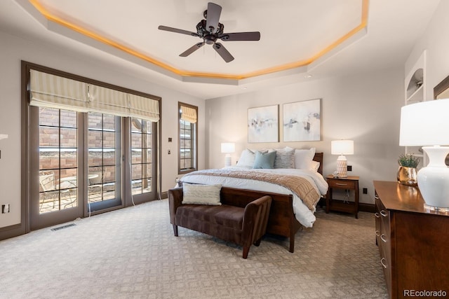5810 Amber Ridge Dr, Castle Pines, CO 80108 - bedroom with a tray ceiling, access to exterior, carpet flooring, and ceiling fan