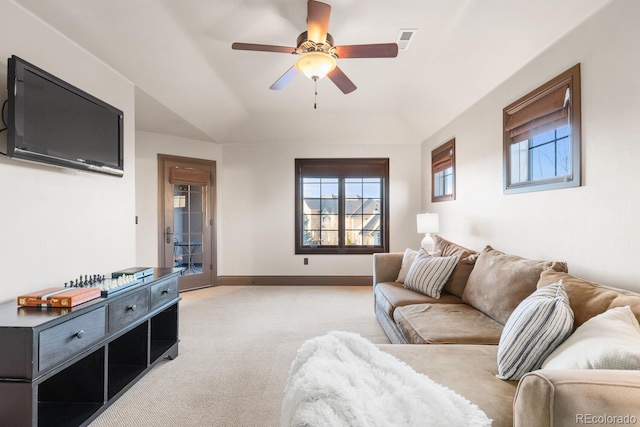 5810 Amber Ridge Dr, Castle Pines, CO 80108 - living room with light carpet, a ceiling fan, baseboards, and a raised ceiling