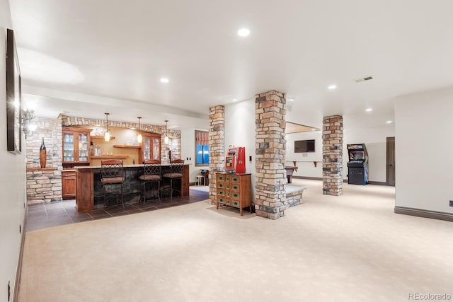 5810 Amber Ridge Dr, Castle Pines, CO 80108 - living room featuring ornate columns, carpet flooring, bar, and recessed lighting