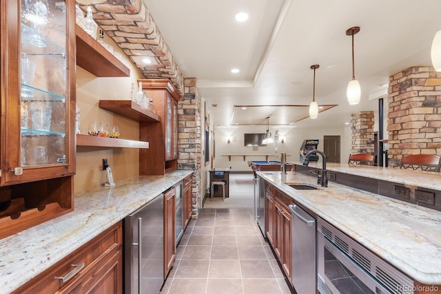 5810 Amber Ridge Dr, Castle Pines, CO 80108 - kitchen with beverage cooler, a sink, open floor plan, stainless steel microwave, and light stone counters
