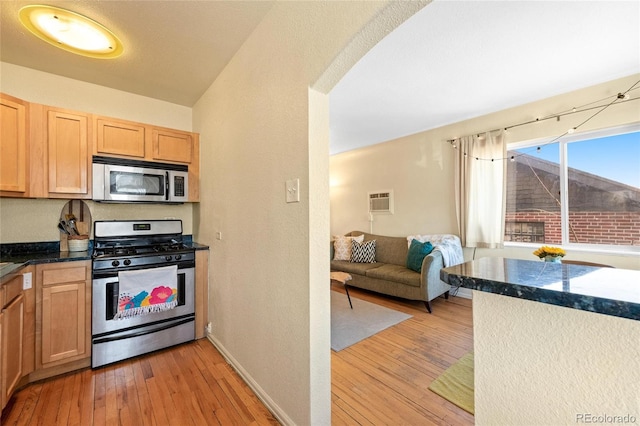 kitchen featuring light hardwood / wood-style floors, light brown cabinetry, and stainless steel appliances