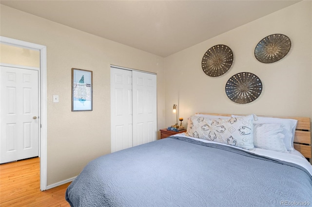 bedroom with hardwood / wood-style flooring