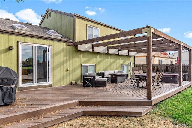 deck featuring outdoor dining space, fence, an outdoor living space, and a hot tub