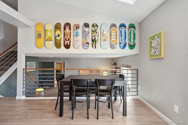 bar featuring baseboards and wood finished floors