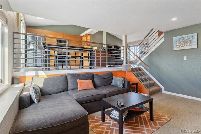 living room with light carpet, stairway, and baseboards