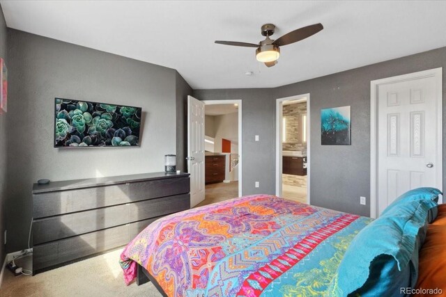 bedroom with carpet, ceiling fan, and ensuite bathroom