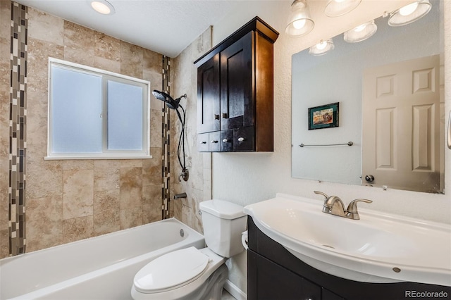 full bathroom featuring toilet, bathtub / shower combination, and vanity