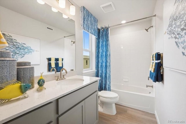 4739 N Valdai Ct, Aurora, CO 80119 - full bathroom with shower / bathtub combination with curtain, wood finished floors, and vanity