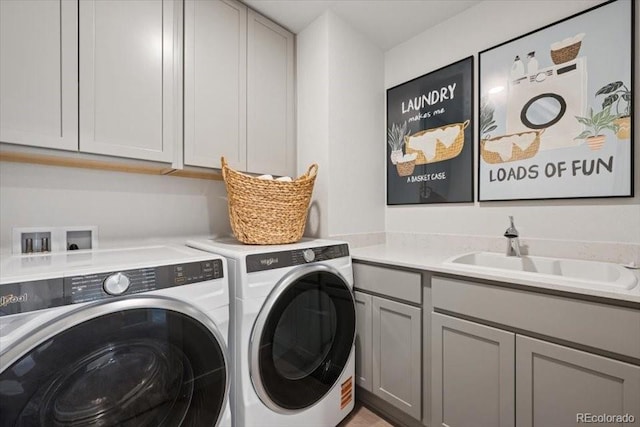 4739 N Valdai Ct, Aurora, CO 80119 - laundry area with washer and clothes dryer and cabinet space