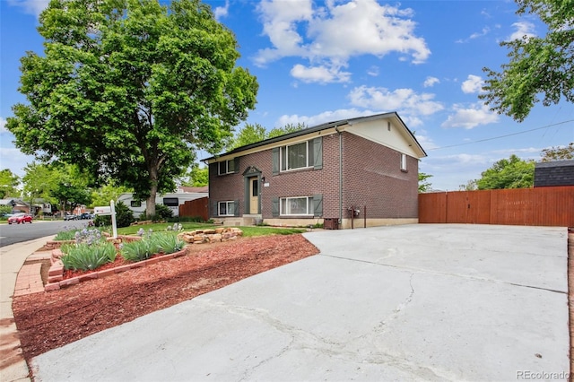 11855 Humboldt Dr, Northglenn, CO 80233 - bi-level home featuring brick siding and driveway