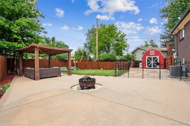 11855 Humboldt Dr, Northglenn, CO 80233 - fenced backyard with a patio, a shed, and an outdoor living space with a fire pit