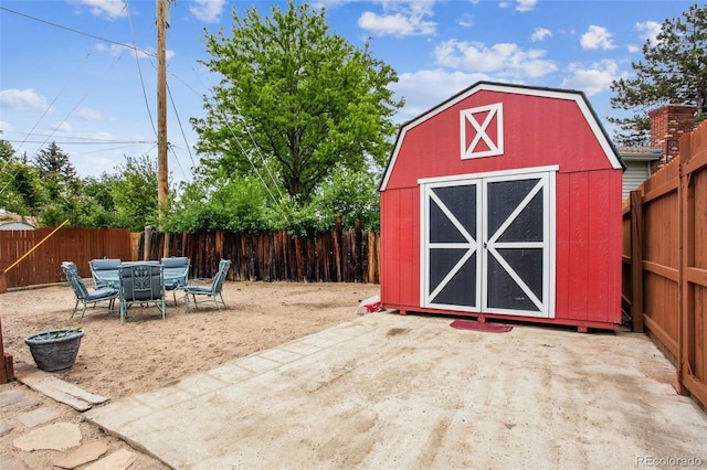 11855 Humboldt Dr, Northglenn, CO 80233 - view of shed featuring a fenced backyard and outdoor dining space