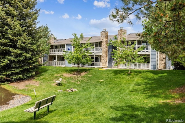 8335 Fairmount Dr Unit 9-201, Denver, CO 80247 - view of home's community featuring a yard