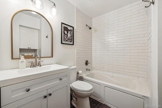 8335 Fairmount Dr Unit 9-201, Denver, CO 80247 - bathroom featuring toilet, vanity, washtub / shower combination, and wood finished floors