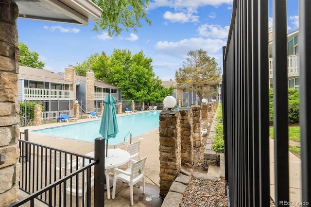 8335 Fairmount Dr Unit 9-201, Denver, CO 80247 - community pool with a patio