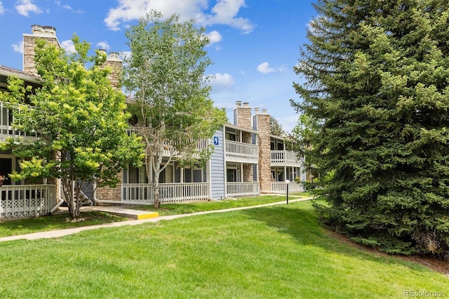 8335 Fairmount Dr Unit 9-201, Denver, CO 80247 - view of community with a lawn
