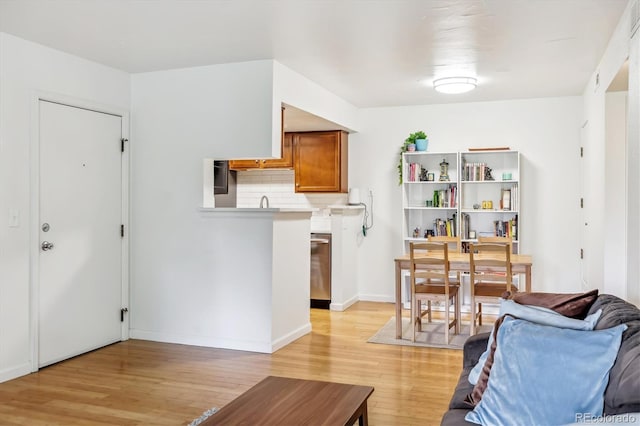 8335 Fairmount Dr Unit 9-201, Denver, CO 80247 - living area featuring light wood-style floors and baseboards