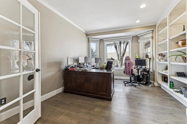 home office featuring hardwood / wood-style flooring, baseboards, and ornamental molding