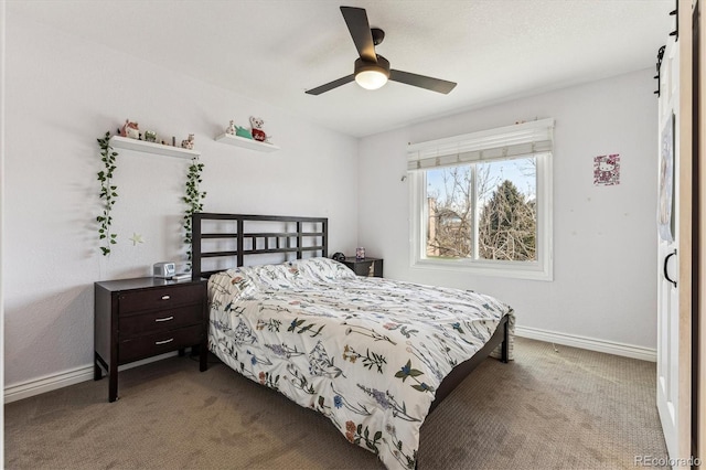 carpeted bedroom featuring a ceiling fan and baseboards