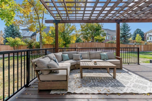 wooden terrace featuring outdoor lounge area, a fenced backyard, and a pergola