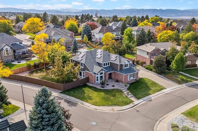 birds eye view of property with a residential view and a mountain view