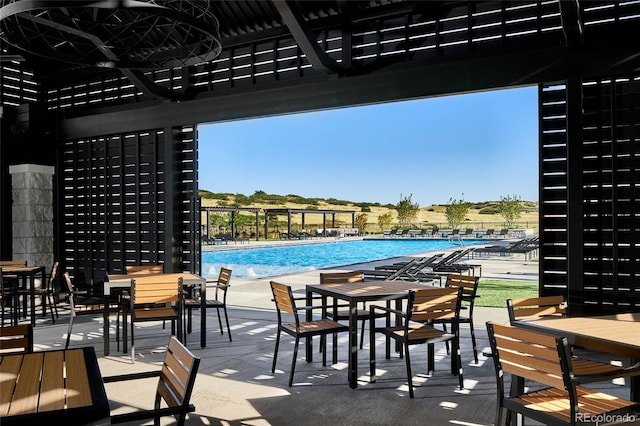 6235 Stable View St, Castle Pines, CO 80108 - community pool featuring a patio area