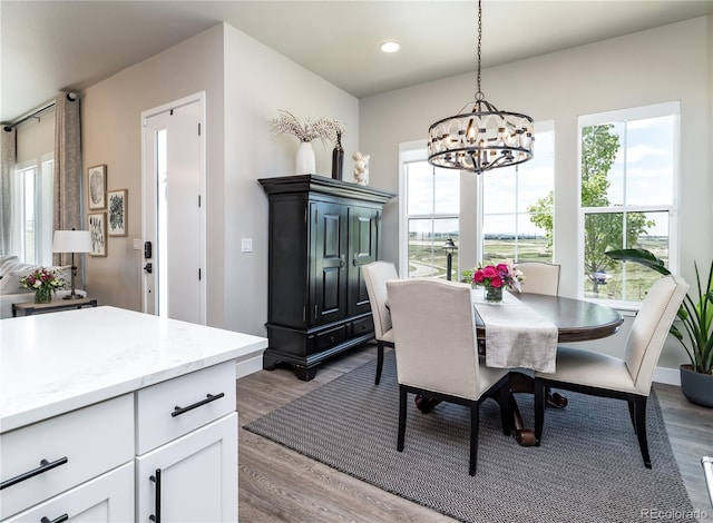6235 Stable View St, Castle Pines, CO 80108 - dining room with a chandelier, dark wood finished floors, and recessed lighting