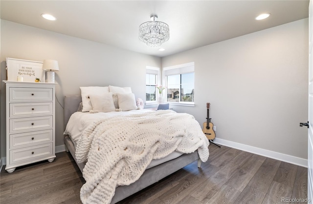6235 Stable View St, Castle Pines, CO 80108 - bedroom with a chandelier, dark wood-style floors, and recessed lighting