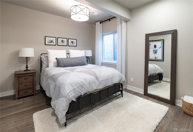 6235 Stable View St, Castle Pines, CO 80108 - bedroom featuring wood finished floors and baseboards