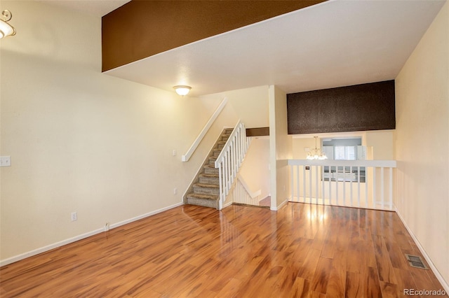 unfurnished living room featuring wood-type flooring